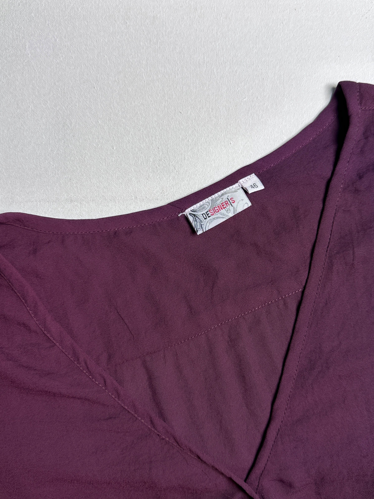 Wine-Colored Casual Top with Asymmetrical Tie Hem and Long Sleeves