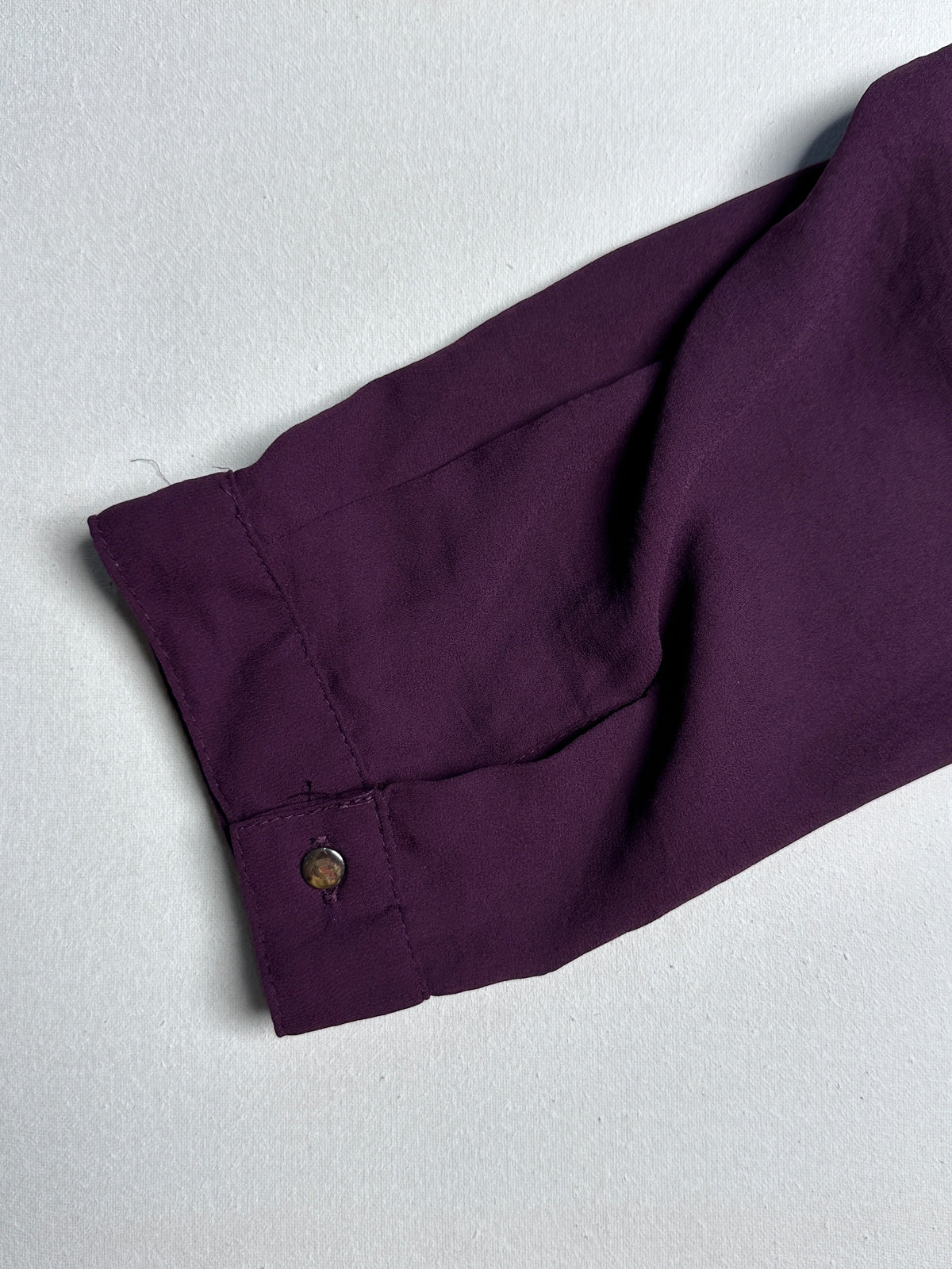 Wine-Colored Casual Top with Asymmetrical Tie Hem and Long Sleeves