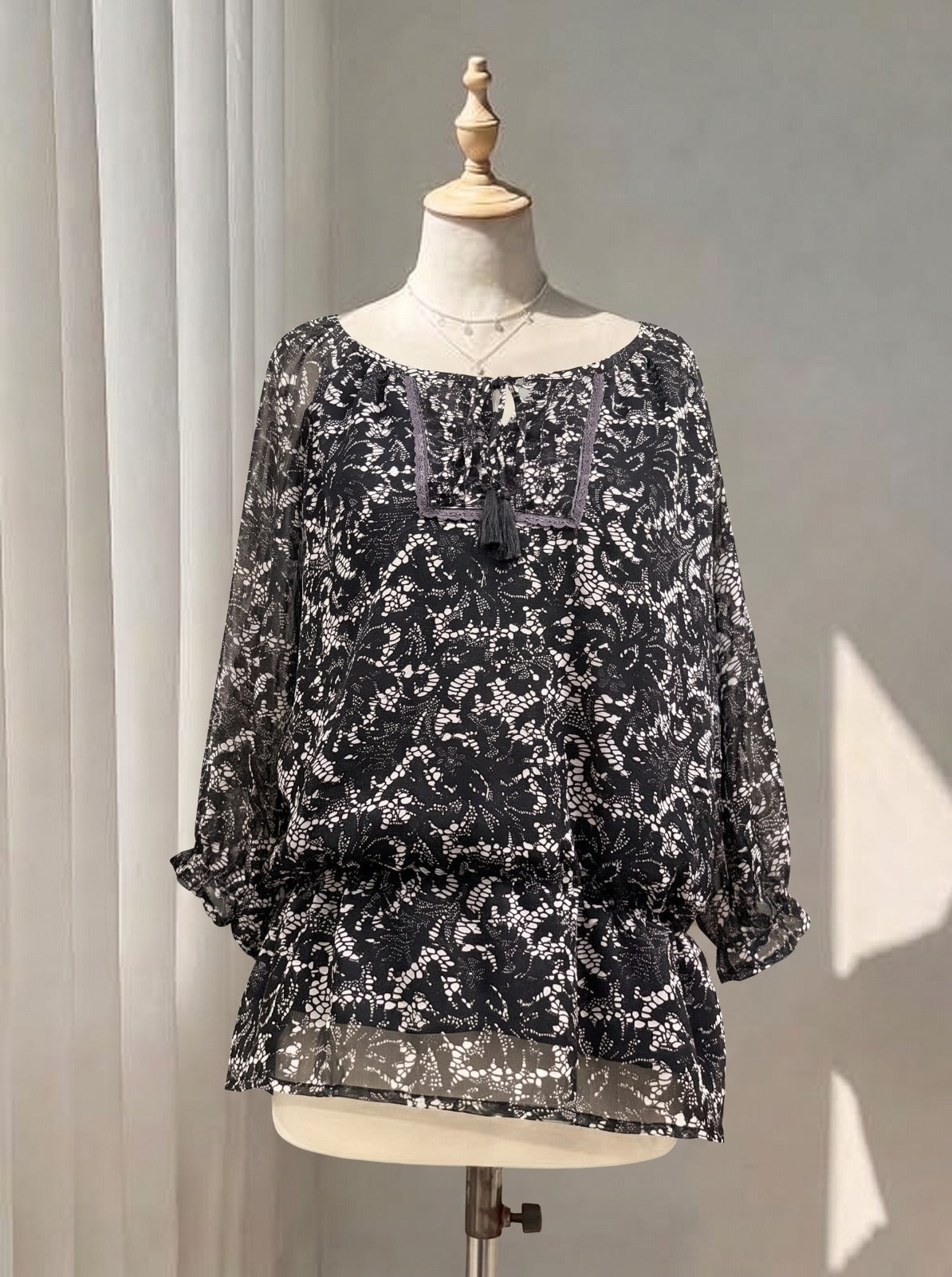 Boho Chic Printed Peasant Top with Tassel Tie Neck & Ruffled Cuffs