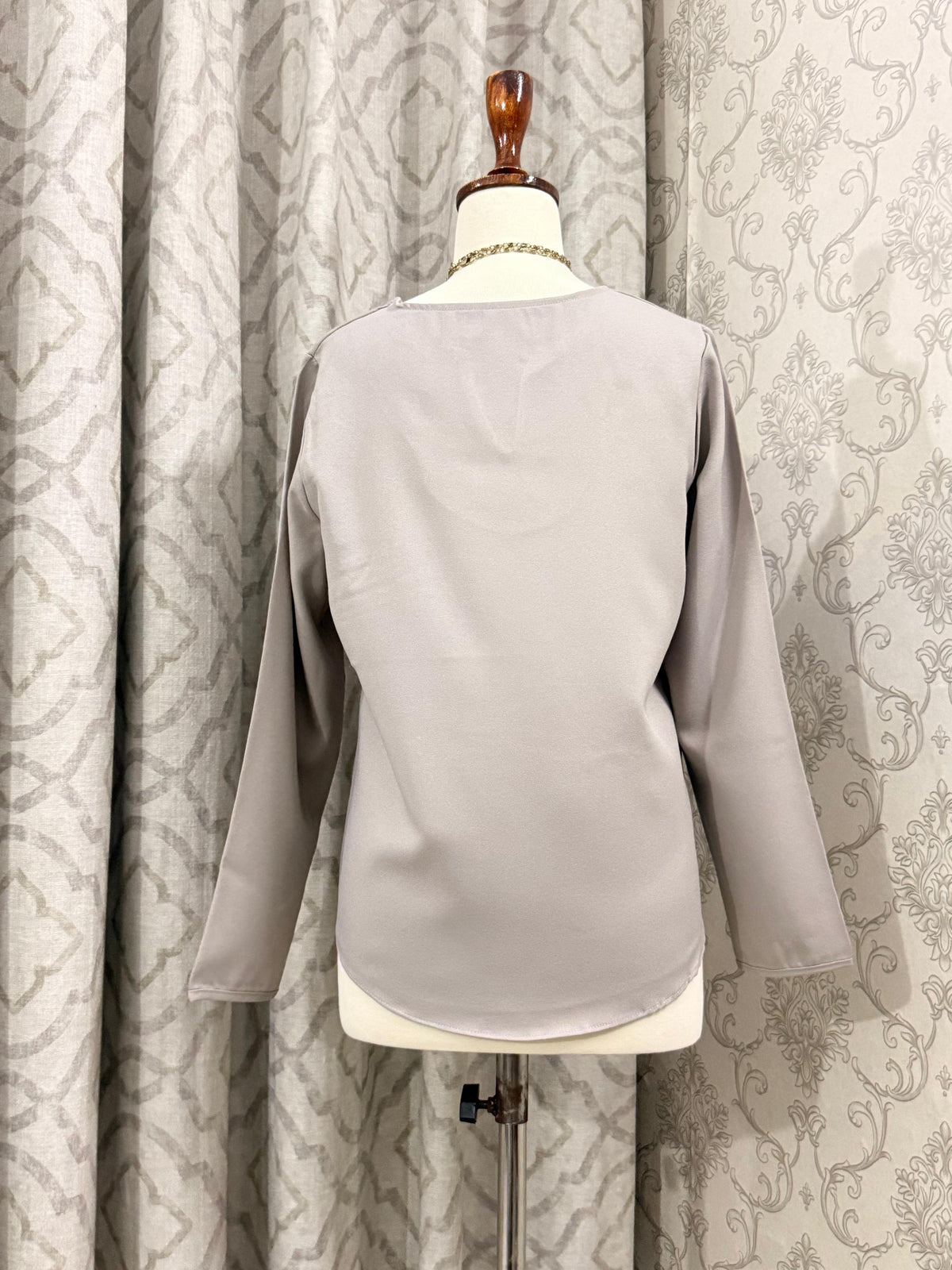 Minimalist Taupe Split-Neck Blouse with Curved Hem & Long Sleeves