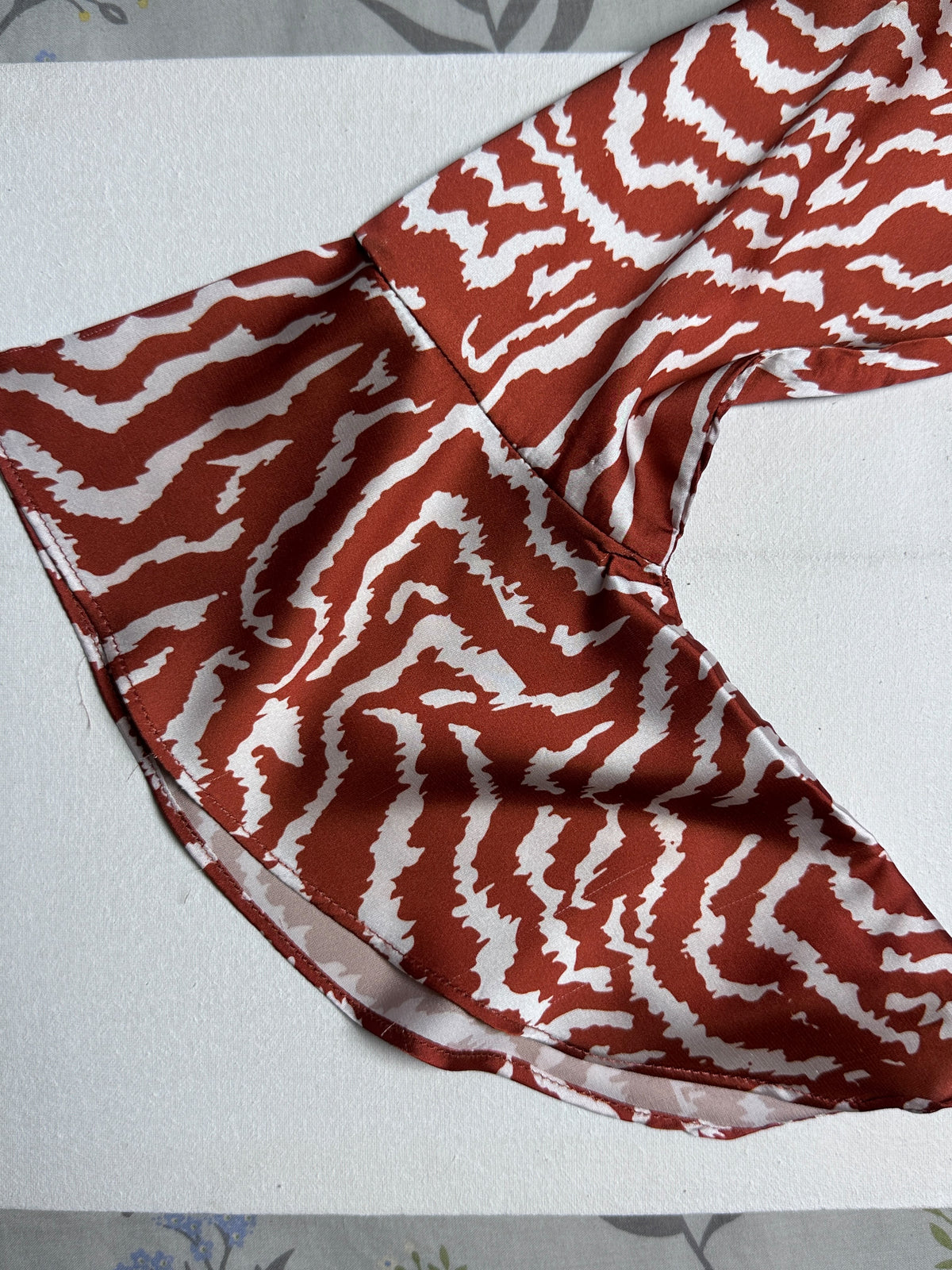 Fiery Wave Print Asymmetric Peplum Top