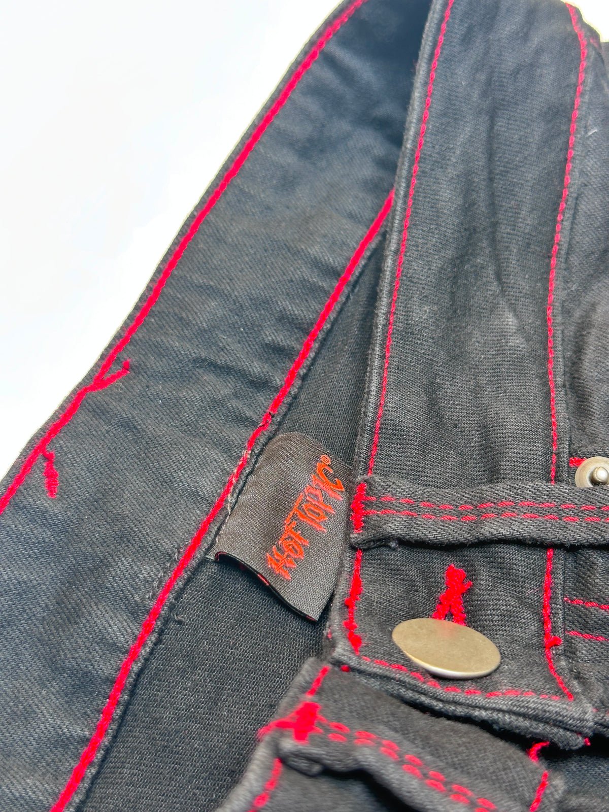 High-Waisted Black Flare Jeans with Red Flame Embroidered Hem & Contrast Stitching